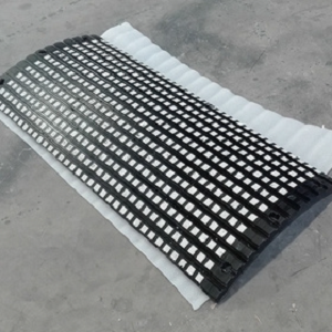 Large rolls of black material stackedIndustrial belt conveyor by JETLUX Conveyors in Kerala